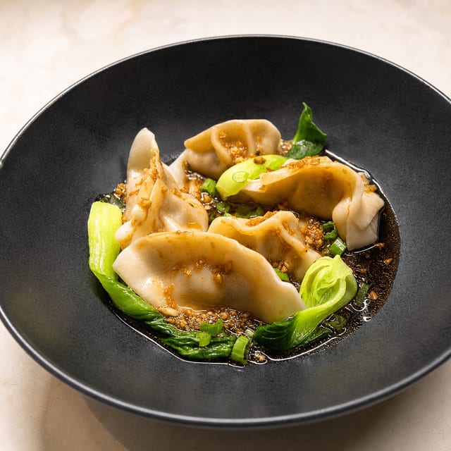 Handmade Dumplings In Spicy Garlic Sauce.